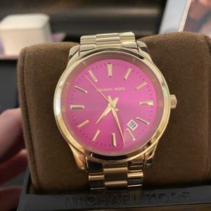 Michael Kors gold tone watch with pink face